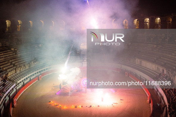 A Zoolians artist captivates the audience with a fiery performance during the closing show of '????????'?????: Arcanes' in the Arles arenas....