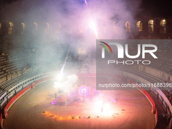 A Zoolians artist captivates the audience with a fiery performance during the closing show of '????????'?????: Arcanes' in the Arles arenas....