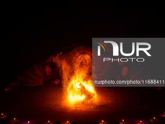 A Zoolians artist captivates the audience with a fiery performance during the closing show of '????????'?????: Arcanes' in the Arles arenas....