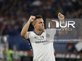 Inter's Lautaro Martinez celebrates after scoring their first goal during the Serie A soccer match between AS Roma and Inter FC at Stadio Ol...