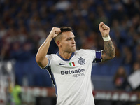 Inter's Lautaro Martinez celebrates after scoring their first goal during the Serie A soccer match between AS Roma and Inter FC at Stadio Ol...