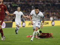 Inter's Lautaro Martinez celebrates after scoring their first goal during the Serie A soccer match between AS Roma and Inter FC at Stadio Ol...