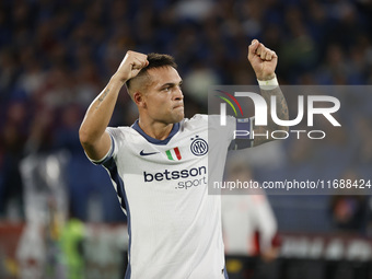 Inter's Lautaro Martinez celebrates after scoring their first goal during the Serie A soccer match between AS Roma and Inter FC at Stadio Ol...