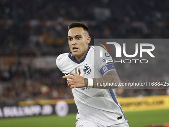 Inter's Lautaro Martinez celebrates after scoring their first goal during the Serie A soccer match between AS Roma and Inter FC at Stadio Ol...