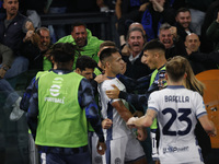 Inter's Lautaro Martinez celebrates after scoring their first goal during the Serie A soccer match between AS Roma and Inter FC at Stadio Ol...