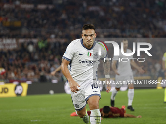 Inter's Lautaro Martinez celebrates after scoring their first goal during the Serie A soccer match between AS Roma and Inter FC at Stadio Ol...