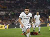 Inter's Lautaro Martinez celebrates after scoring their first goal during the Serie A soccer match between AS Roma and Inter FC at Stadio Ol...