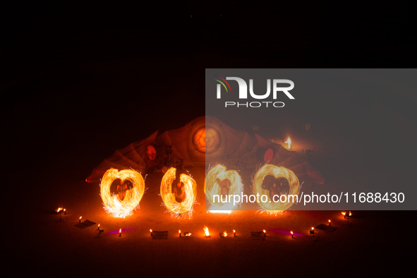 A Zoolians artist captivates the audience with a fiery performance during the closing show of '????????'?????: Arcanes' in the Arles arenas....