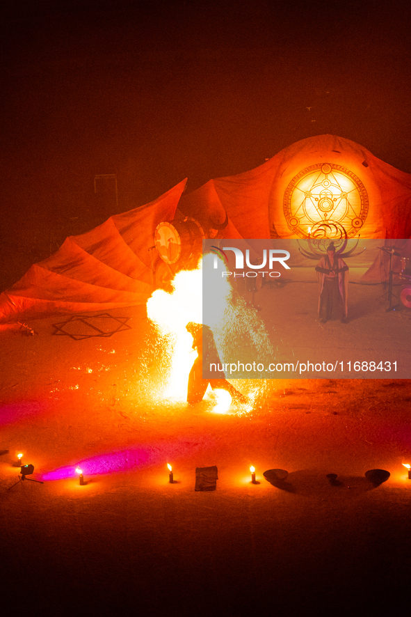 A Zoolians artist captivates the audience with a fiery performance during the closing show of '????????'?????: Arcanes' in the Arles arenas....