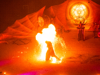 A Zoolians artist captivates the audience with a fiery performance during the closing show of '????????'?????: Arcanes' in the Arles arenas....