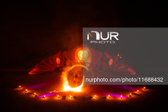 A Zoolians artist captivates the audience with a fiery performance during the closing show of '????????'?????: Arcanes' in the Arles arenas....