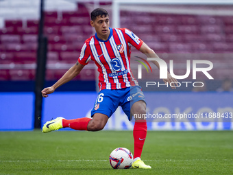 Nahuel Molina of Atletico de Madrid is in action with the ball during the La Liga EA Sports 2024/25 football match between Atletico de Madri...