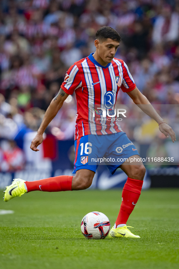 Nahuel Molina of Atletico de Madrid is in action with the ball during the La Liga EA Sports 2024/25 football match between Atletico de Madri...