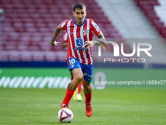 Angel Correa of Atletico de Madrid is in action with the ball during the La Liga EA Sports 2024/25 football match between Atletico de Madrid...