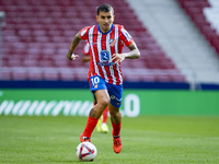 Angel Correa of Atletico de Madrid is in action with the ball during the La Liga EA Sports 2024/25 football match between Atletico de Madrid...