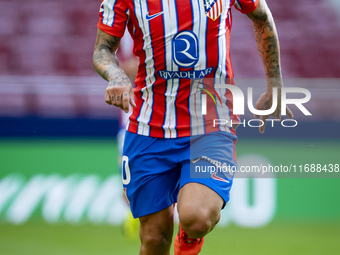 Angel Correa of Atletico de Madrid is in action with the ball during the La Liga EA Sports 2024/25 football match between Atletico de Madrid...