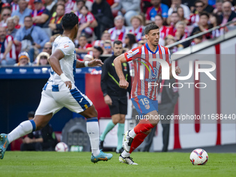 Clement Lenglet of Atletico de Madrid (R) is in action against Renato Tapia of CD Leganes (L) during the La Liga EA Sports 2024/25 football...