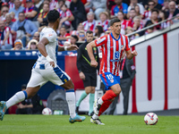 Clement Lenglet of Atletico de Madrid (R) is in action against Renato Tapia of CD Leganes (L) during the La Liga EA Sports 2024/25 football...