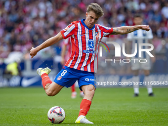 Pablo Barrios of Atletico de Madrid attempts a kick during the La Liga EA Sports 2024/25 football match between Atletico de Madrid and CD Le...