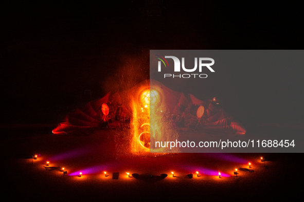 A Zoolians artist captivates the audience with a fiery performance during the closing show of '????????'?????: Arcanes' in the Arles arenas....