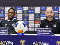 Felix Sanchez Bas, Head Coach of Al Sadd FC, and player Meshal Barsham attend a press conference at Jassim Bin Hamad Stadium in Doha, Qatar,...