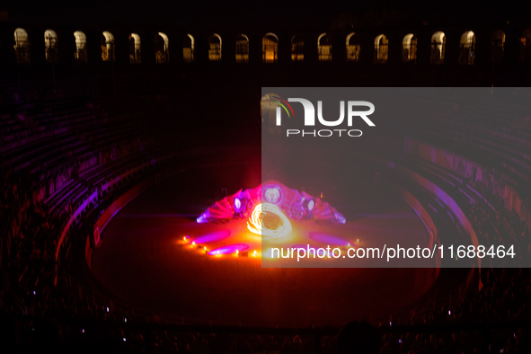 A Zoolians artist captivates the audience with a fiery performance during the closing show of '????????'?????: Arcanes' in the Arles arenas....