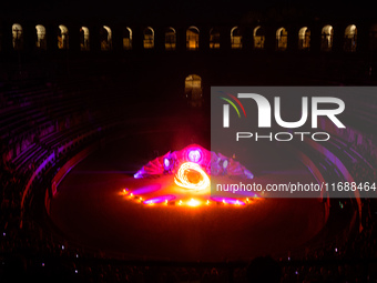 A Zoolians artist captivates the audience with a fiery performance during the closing show of '????????'?????: Arcanes' in the Arles arenas....