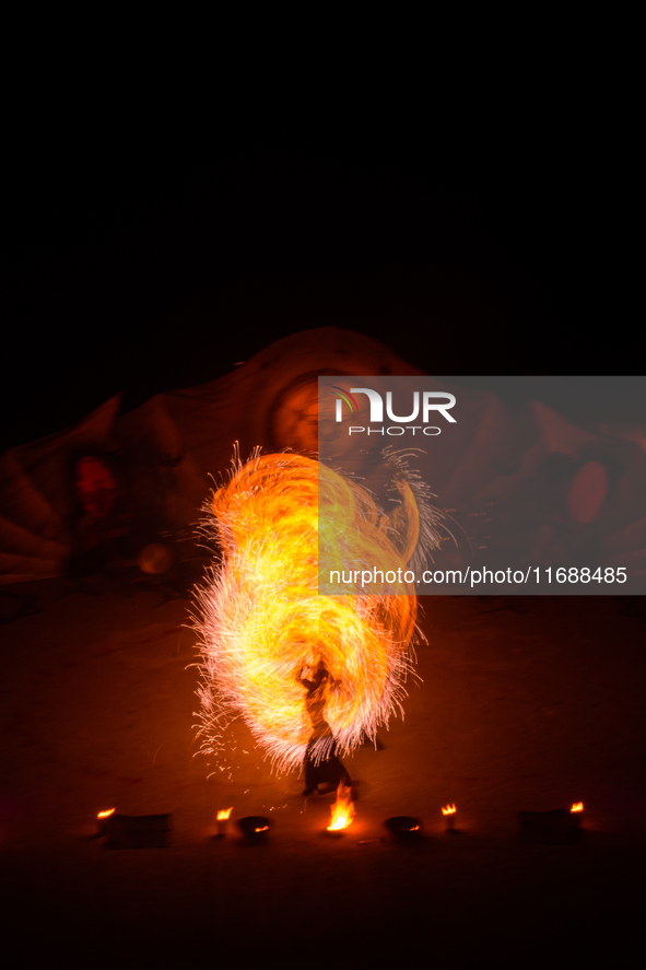 A Zoolians artist captivates the audience with a fiery performance during the closing show of '????????'?????: Arcanes' in the Arles arenas....