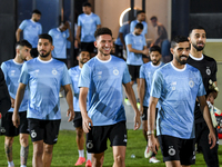 Players of Al Sadd SC stand before the training session at Jassim Bin Hamad Stadium in Doha, Qatar, on October 20, 2024, ahead of the AFC Ch...