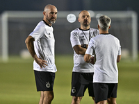 Felix Sanchez Bas (L), Head Coach of Al Sadd FC, participates in the training session at Jassim Bin Hamad Stadium in Doha, Qatar, on October...