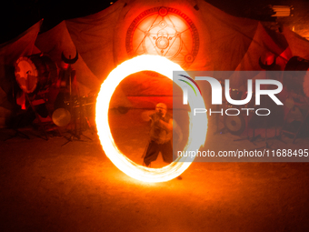 A Zoolians artist captivates the audience with a fiery performance during the closing show of '????????'?????: Arcanes' in the Arles arenas....