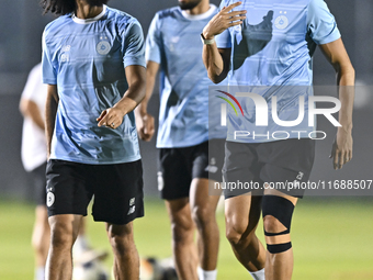 Akram Hassan Afif (L) and Romain Saiss (R) of Al Sadd FC participate in the training session at Jassim Bin Hamad Stadium in Doha, Qatar, on...