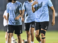 Akram Hassan Afif (L) and Romain Saiss (R) of Al Sadd FC participate in the training session at Jassim Bin Hamad Stadium in Doha, Qatar, on...