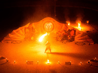 A Zoolians artist captivates the audience with a fiery performance during the closing show of '????????'?????: Arcanes' in the Arles arenas....