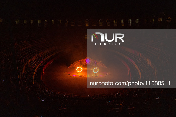 A Zoolians artist captivates the audience with a fiery performance during the closing show of '????????'?????: Arcanes' in the Arles arenas....