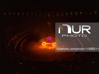 A Zoolians artist captivates the audience with a fiery performance during the closing show of '????????'?????: Arcanes' in the Arles arenas....