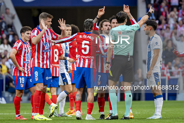 Players of Atletico de Madrid (from left to right) Alexander Sorloth, Rodrigo De Paul, and Antoine Griezmann argue with the referee during t...