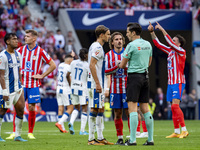 Antoine Griezmann of Atletico de Madrid argues with the referee during the La Liga EA Sports 2024/25 football match between Atletico de Madr...