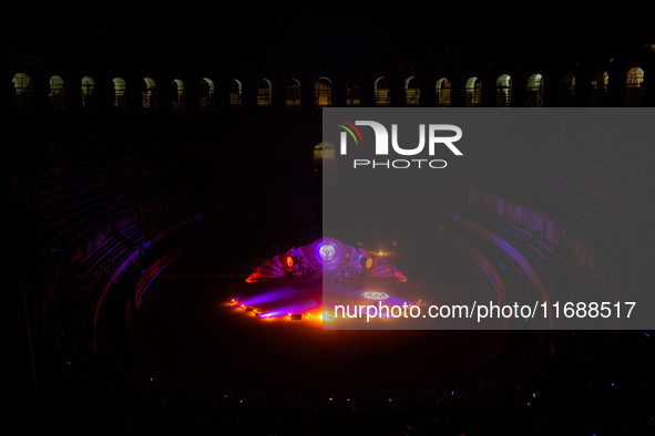 A Zoolians artist captivates the audience with a fiery performance during the closing show of '????????'?????: Arcanes' in the Arles arenas....