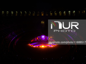 A Zoolians artist captivates the audience with a fiery performance during the closing show of '????????'?????: Arcanes' in the Arles arenas....