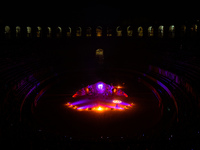 A Zoolians artist captivates the audience with a fiery performance during the closing show of '????????'?????: Arcanes' in the Arles arenas....