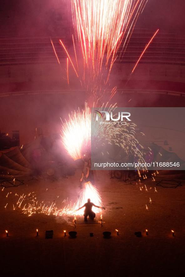 A Zoolians artist captivates the audience with a fiery performance during the closing show of '????????'?????: Arcanes' in the Arles arenas....