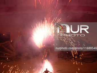 A Zoolians artist captivates the audience with a fiery performance during the closing show of '????????'?????: Arcanes' in the Arles arenas....