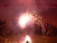 A Zoolians artist captivates the audience with a fiery performance during the closing show of '????????'?????: Arcanes' in the Arles arenas....