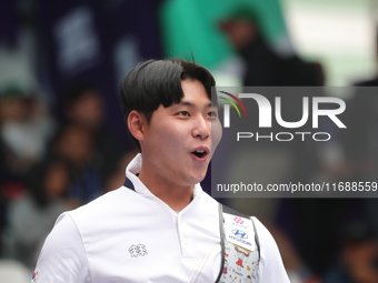 Lee Woo Seok of Korea competes against Kim Woojin of Korea (not in picture) during the Men's recurve final match on the final day of the Tla...