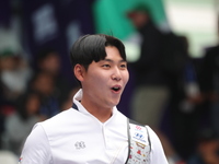 Lee Woo Seok of Korea competes against Kim Woojin of Korea (not in picture) during the Men's recurve final match on the final day of the Tla...