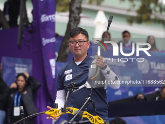 Kim Woojin of Korea competes against Lee Woo Seok of Korea (not in picture) during the Men's recurve final match on the final day of the Tla...