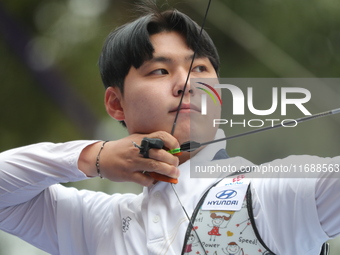 Lee Woo Seok of Korea competes against Kim Woojin of Korea (not in picture) during the Men's recurve final match on the final day of the Tla...