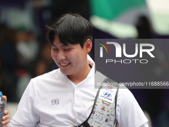 Lee Woo Seok of Korea competes against Kim Woojin of Korea (not in picture) during the Men's recurve final match on the final day of the Tla...