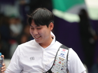 Lee Woo Seok of Korea competes against Kim Woojin of Korea (not in picture) during the Men's recurve final match on the final day of the Tla...